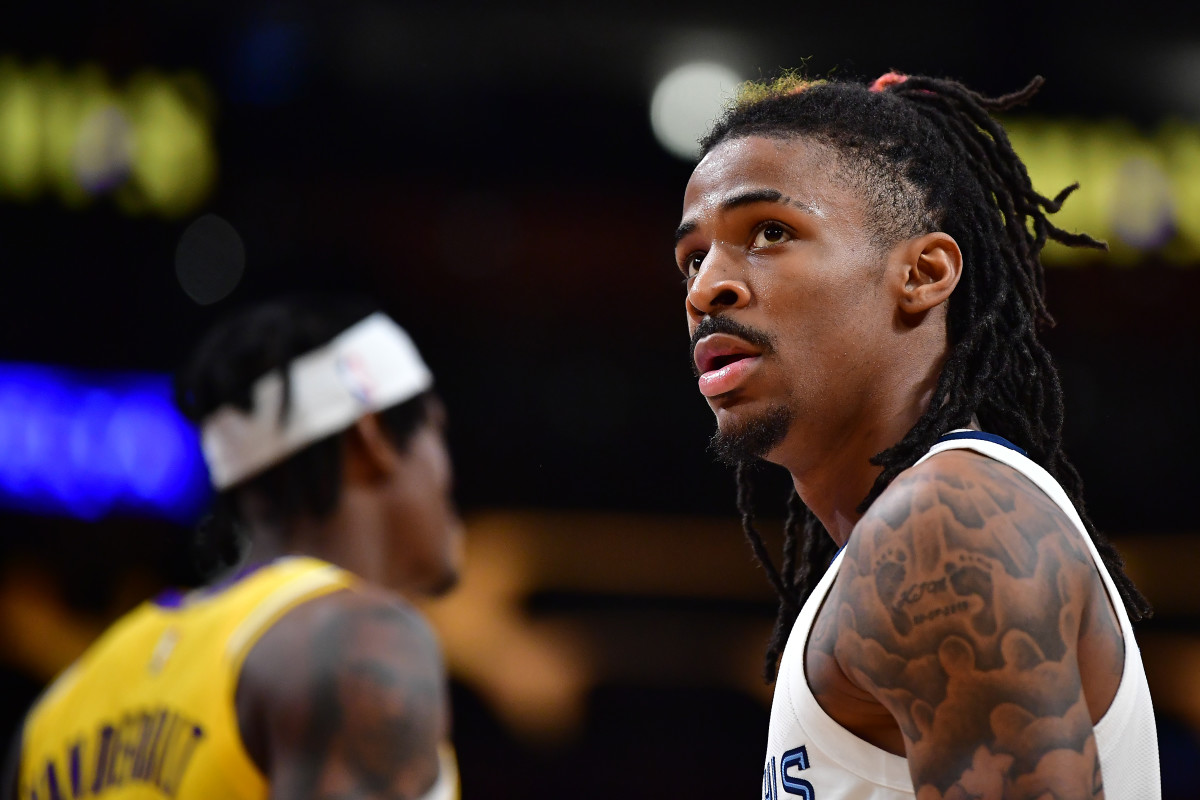 Ja Morant looks up at the scoreboard during a time out.